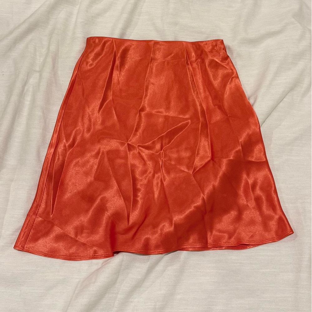 Babaton Asymmetrical Satin Skirt in Vibrant Orange